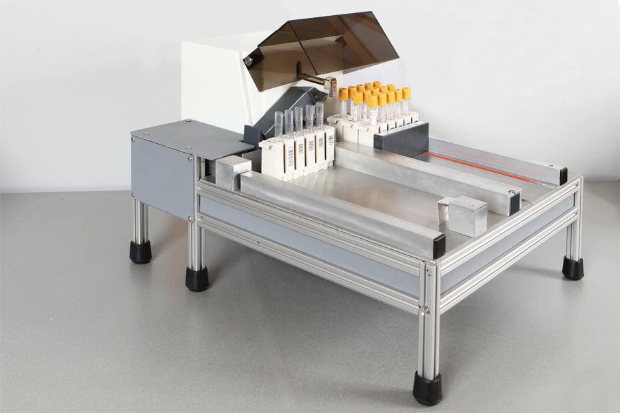 Picture of the decapper KapSafe showing different analyzer racks that can be handled by the device